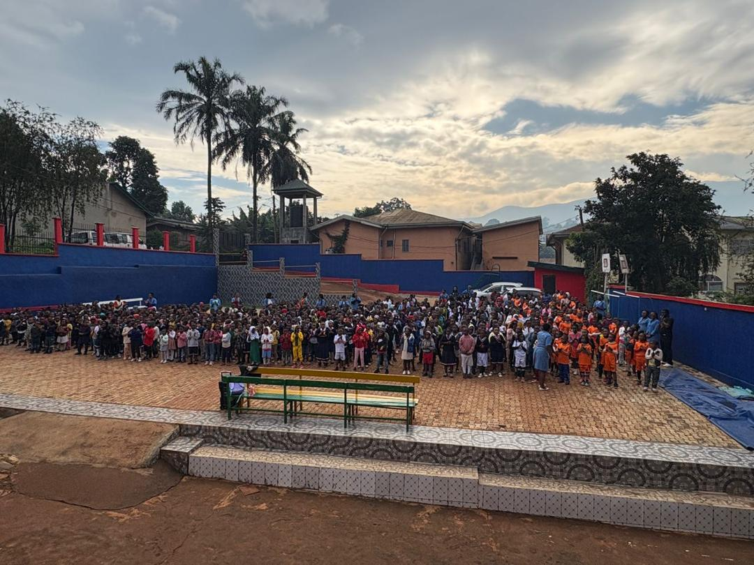Whole-school morning assembly on the campus yard